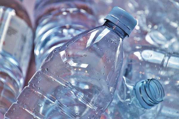 A pile of empty single-use water bottles