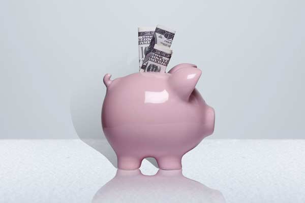 Piggy bank representing money that can be saved with an office water filtration system in Austin TX